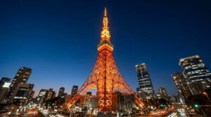 Tokyo Tower illuminated at night in orange and red lights - iconic landmark view